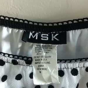 A line skt white with black polka dots, black trim